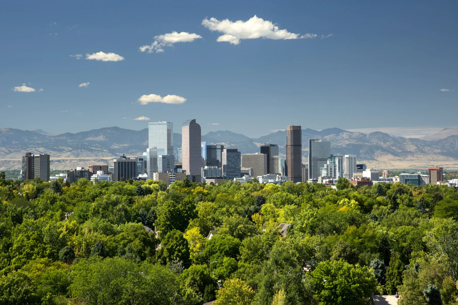 The Denver skyline against the Rocky Mountains